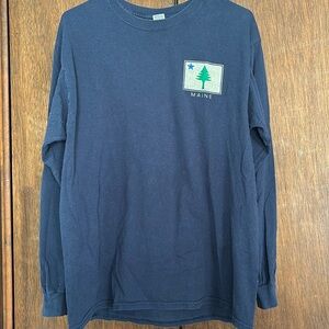 State of Maine long sleeved tshirt. Navy blue with tree and star emblem.